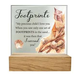 Standing glass plaque with Footprints verse, bevelled edges, and wooden base.