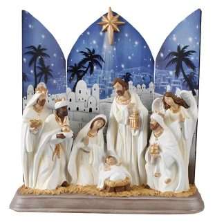7-piece white resin nativity scene ornament with gold highlights on wood background and base