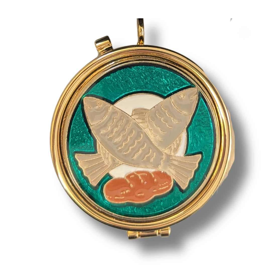 Communion pyx with fish and loaves design detail on lid.